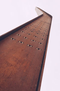 Low angle view of rusty metal against sky