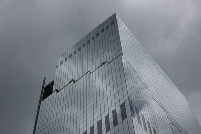 Low angle view of skyscraper against sky