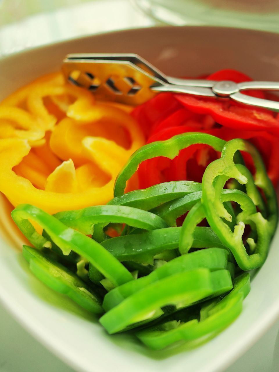 CLOSE-UP OF CHOPPED TOMATOES IN BOWL