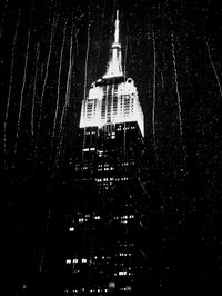 Low angle view of illuminated building at night