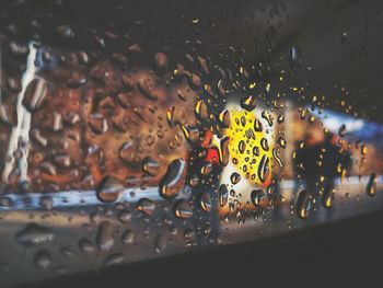 Close-up of water drops on metal