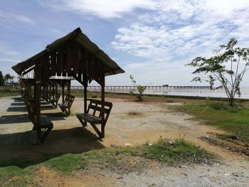 Gazebo on beach against sky