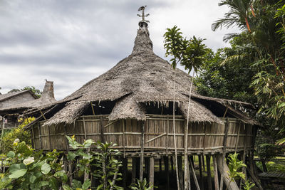 Low angle view of building against cloudy sky