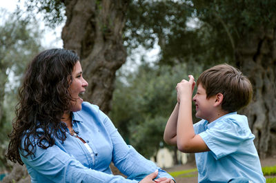 Side view of mother and son