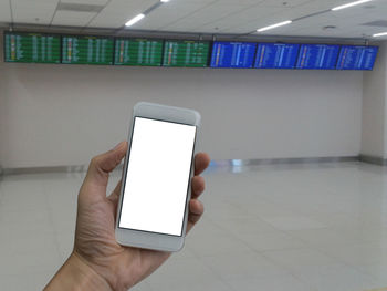 Midsection of man using mobile phone