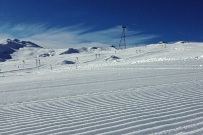 Scenic view of snow covered mountains against sky