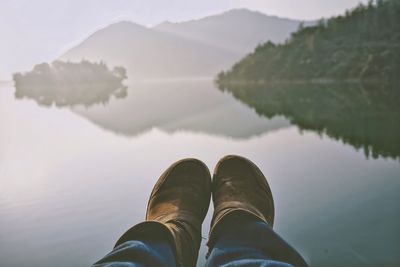 Low section of person over lake