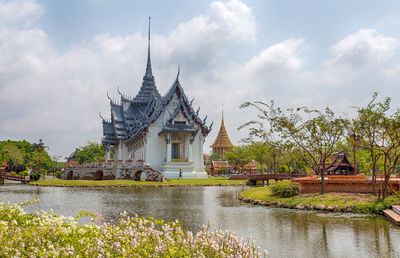 View of temple building against cloudy sky