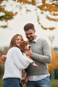Young woman with dogs on field
