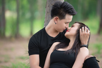 Young couple kissing on land