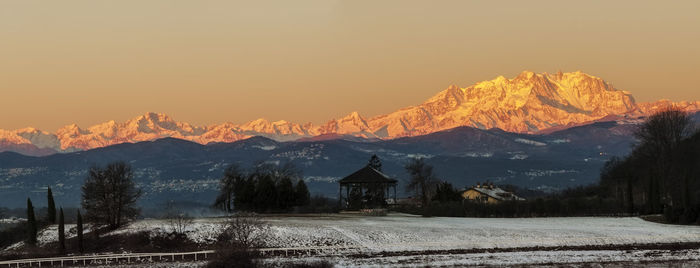 Scenic view of mountains against sky during sunset