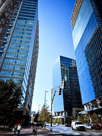 Low angle view of skyscrapers against clear sky