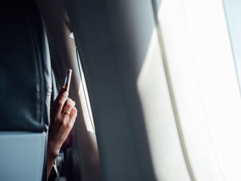 Midsection of woman using mobile phone