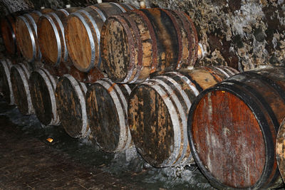 Stack of old barrels in wine cellar