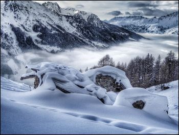 Scenic view of snow covered mountains