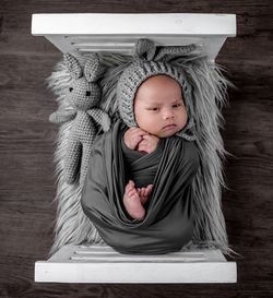Portrait of cute girl sitting on table