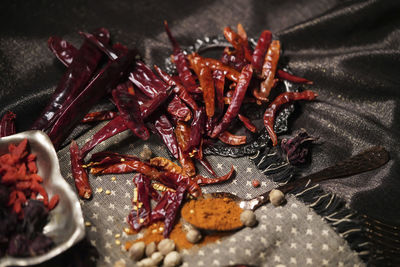 High angle view of red chili peppers in plate on table