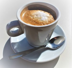 Close-up of coffee cup on table