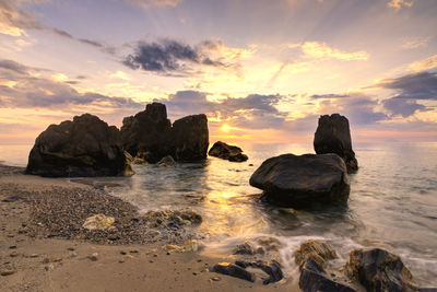 Scenic view of sea against sky at sunset