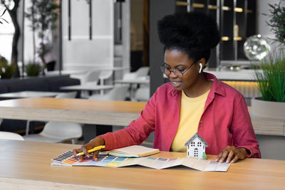 African american woman architect, engineer designer, student working residential building project