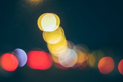 Defocused image of illuminated lights at night