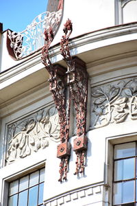 Low angle view of statue against building