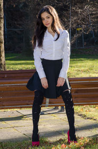 Portrait of smiling young woman standing outdoors