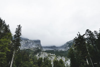 Scenic view of waterfall against sky