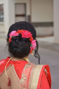 Rear view of woman in traditional clothing standing outdoors