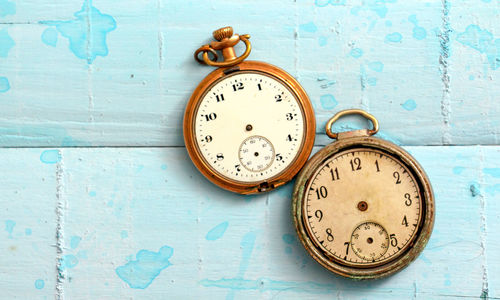 Directly above shot of old pocket watches on table