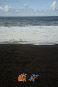 Scenic view of sea against cloudy sky