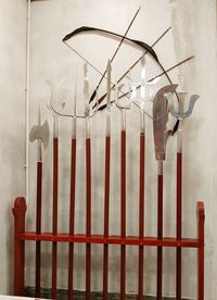 Close-up of metal hanging against wall in building