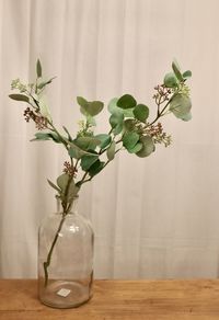 Close-up of flower vase on table
