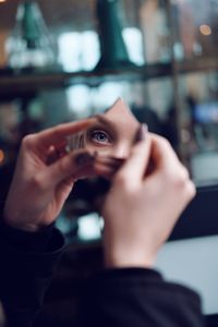 Close-up portrait of man holding hands