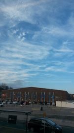 View of buildings against cloudy sky