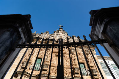 Low angle view of building against clear blue sky