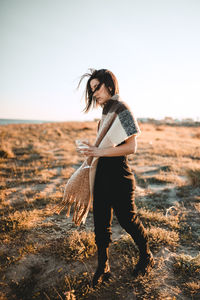 Full length of woman standing on land