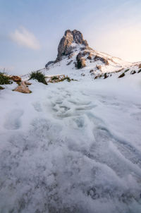 Scenic view of snow covered mountain against sky