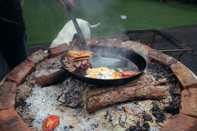 High angle view of meat cooking on barbecue grill