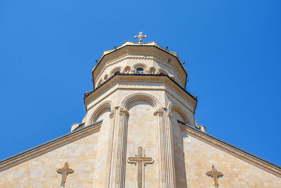 Low angle view of building against clear blue sky