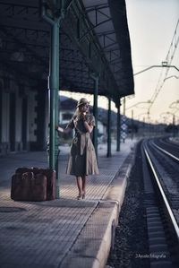 Full length of woman at railroad station