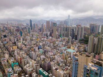 Aerial view of modern buildings in city against sky