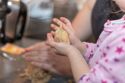 Midsection of girl preparing food