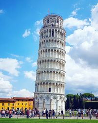 Low angle view of historical building against cloudy sky