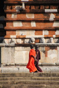 Low angle view of monks walking by temple
