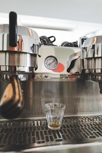 Empty glass in the coffee machine