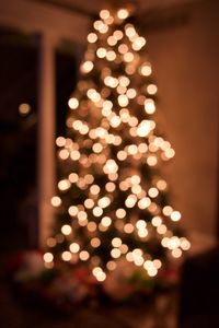 Defocused image of illuminated christmas tree