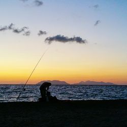 Silhouette of people on beach