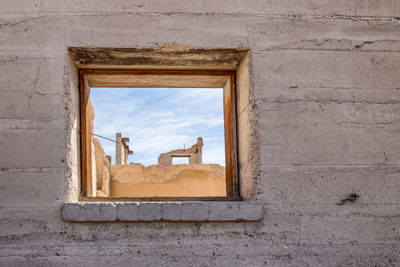 Abandoned building seen through window