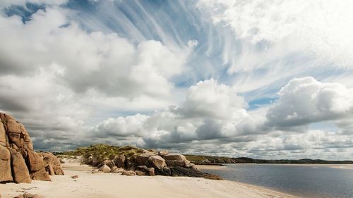 Scenic view of sea against cloudy sky